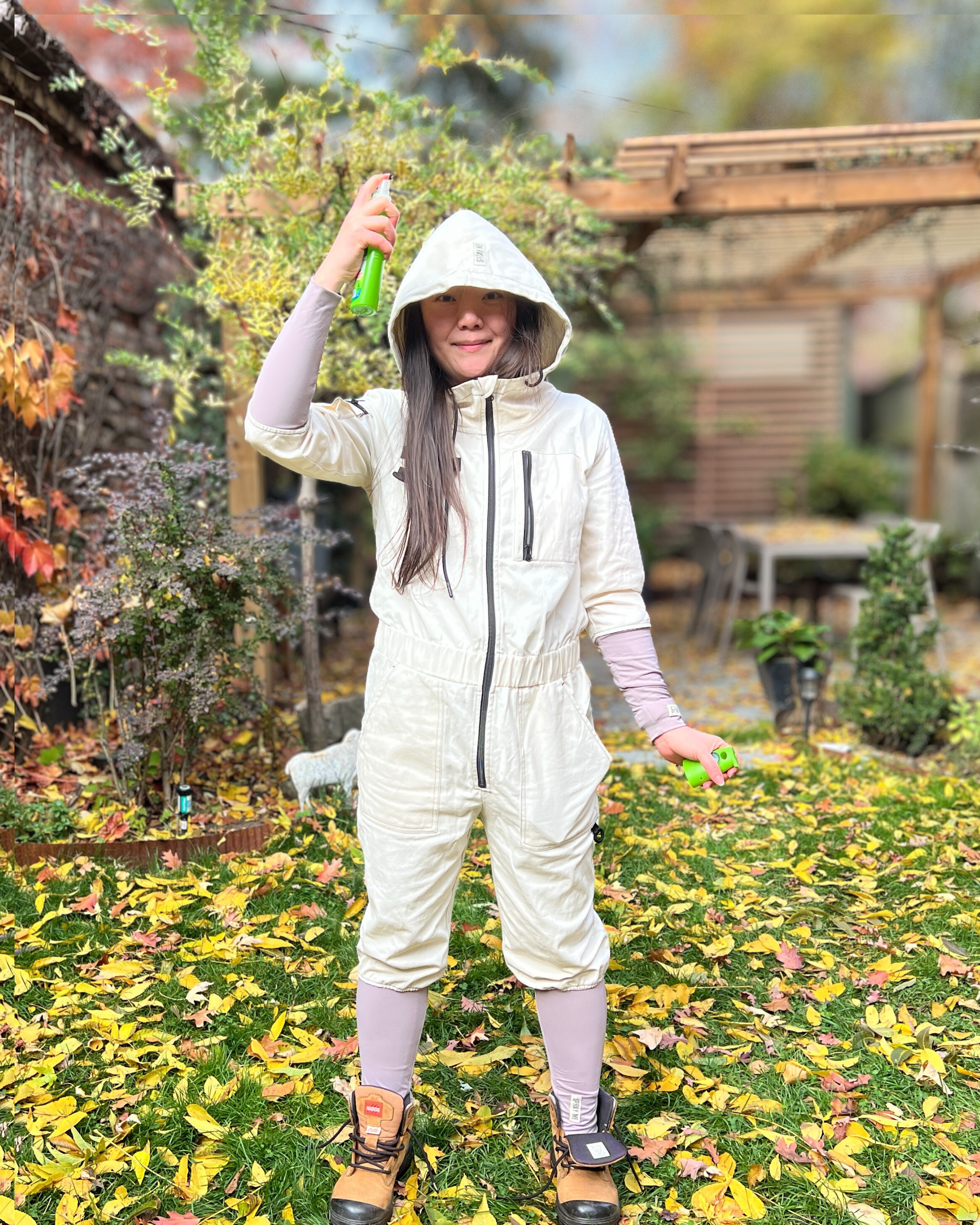Gardener wearing TickOffTicks tick suit while working in a backyard garden.